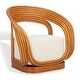 Giorno Rattan Accent Chair by Vintara Design, side view showing sculptural organic rattan frame and white linen cushion.