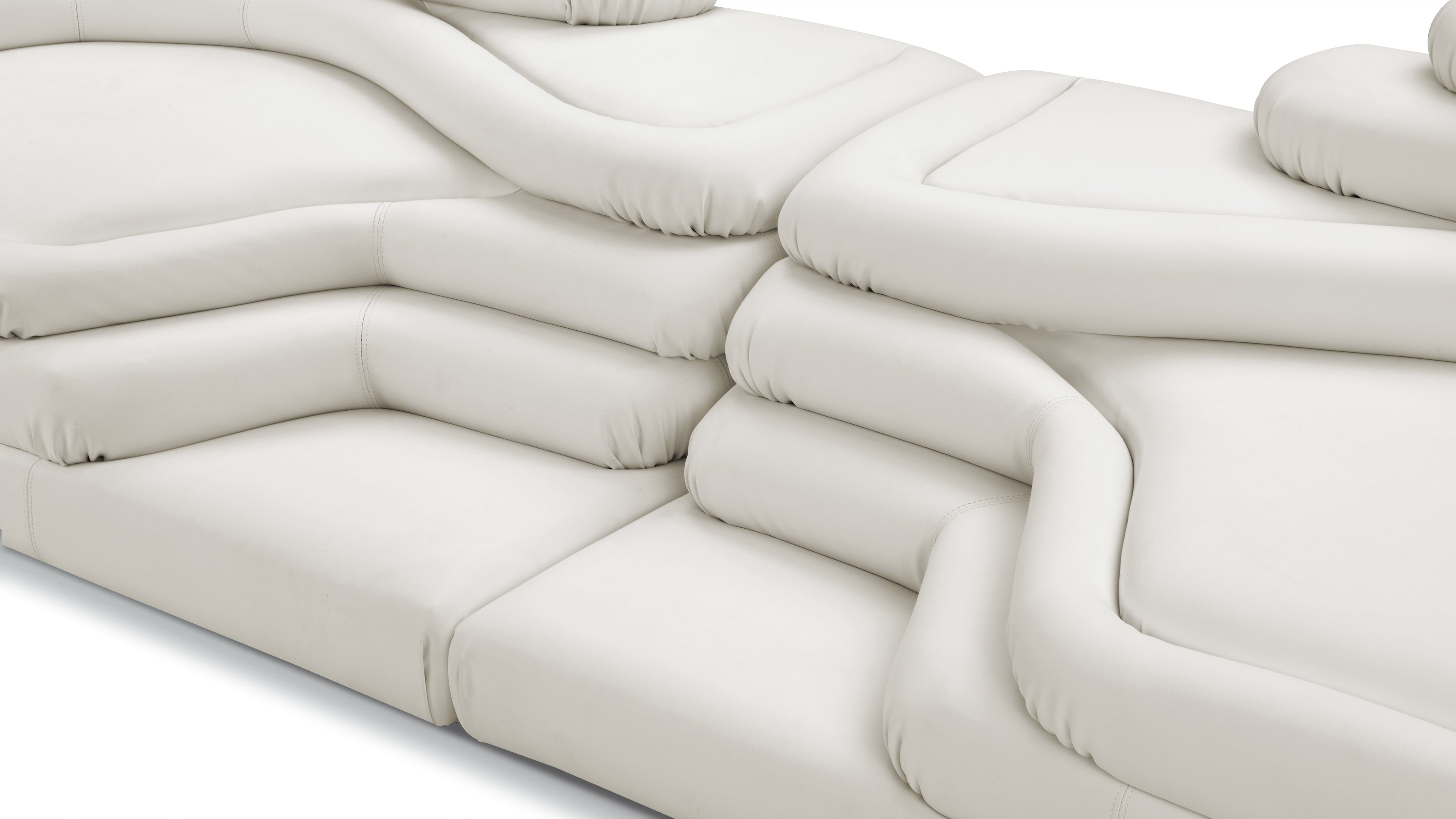 Terrazza Sofa in warm white vegan leather, embodying modern elegance and comfort.