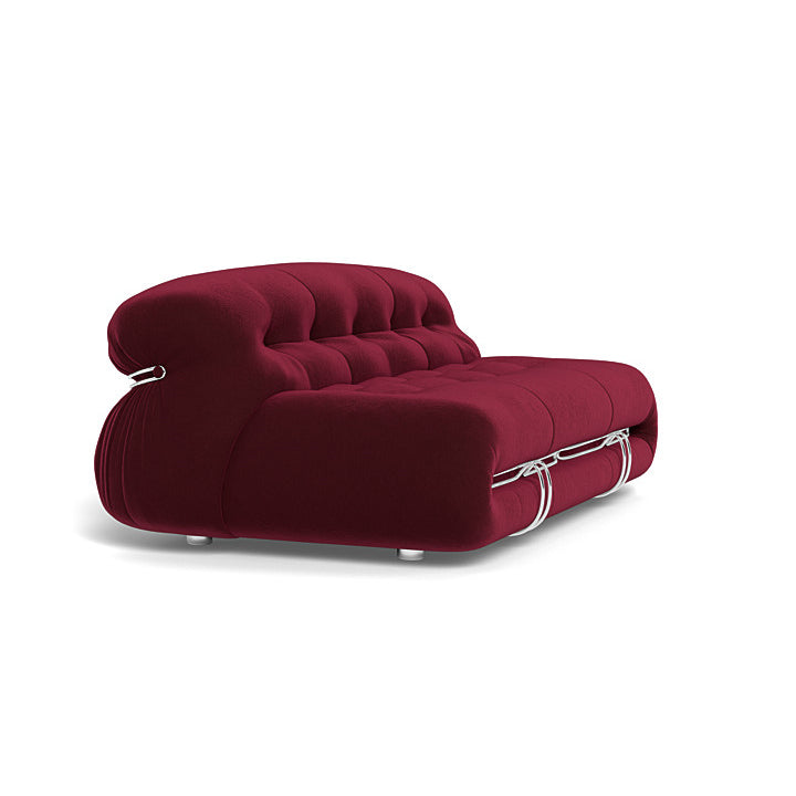Sophisticated Soriana sofa with visually striking metal vise structure in a cozy corner.