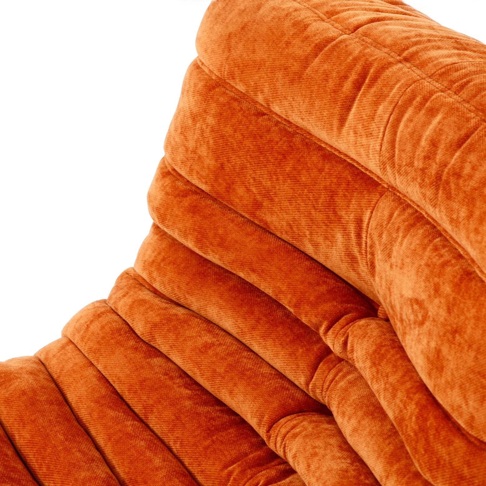 Cozy Togo sofa fireside chair, ideal for unwinding or enjoying a lazy Sunday afternoon.