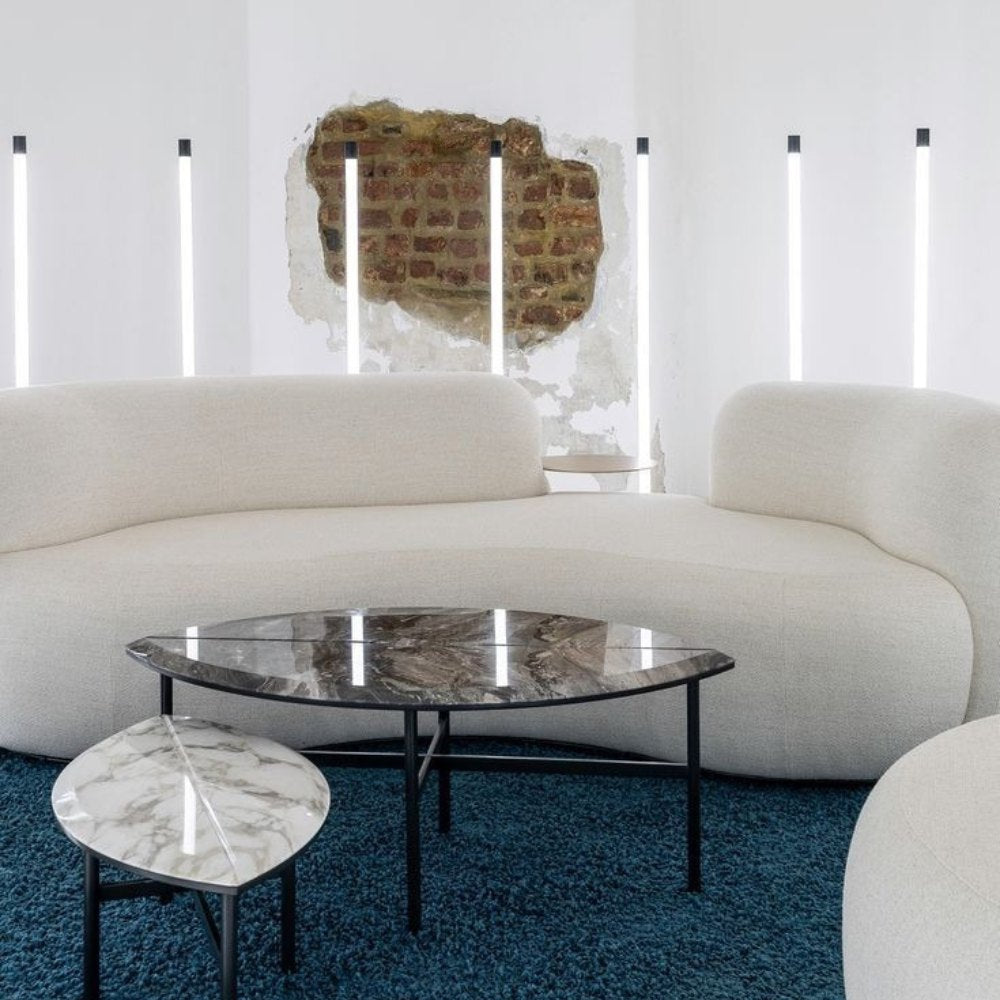 Tateyama Sofa, a luxurious furniture piece with integrated side tables for added functionality.