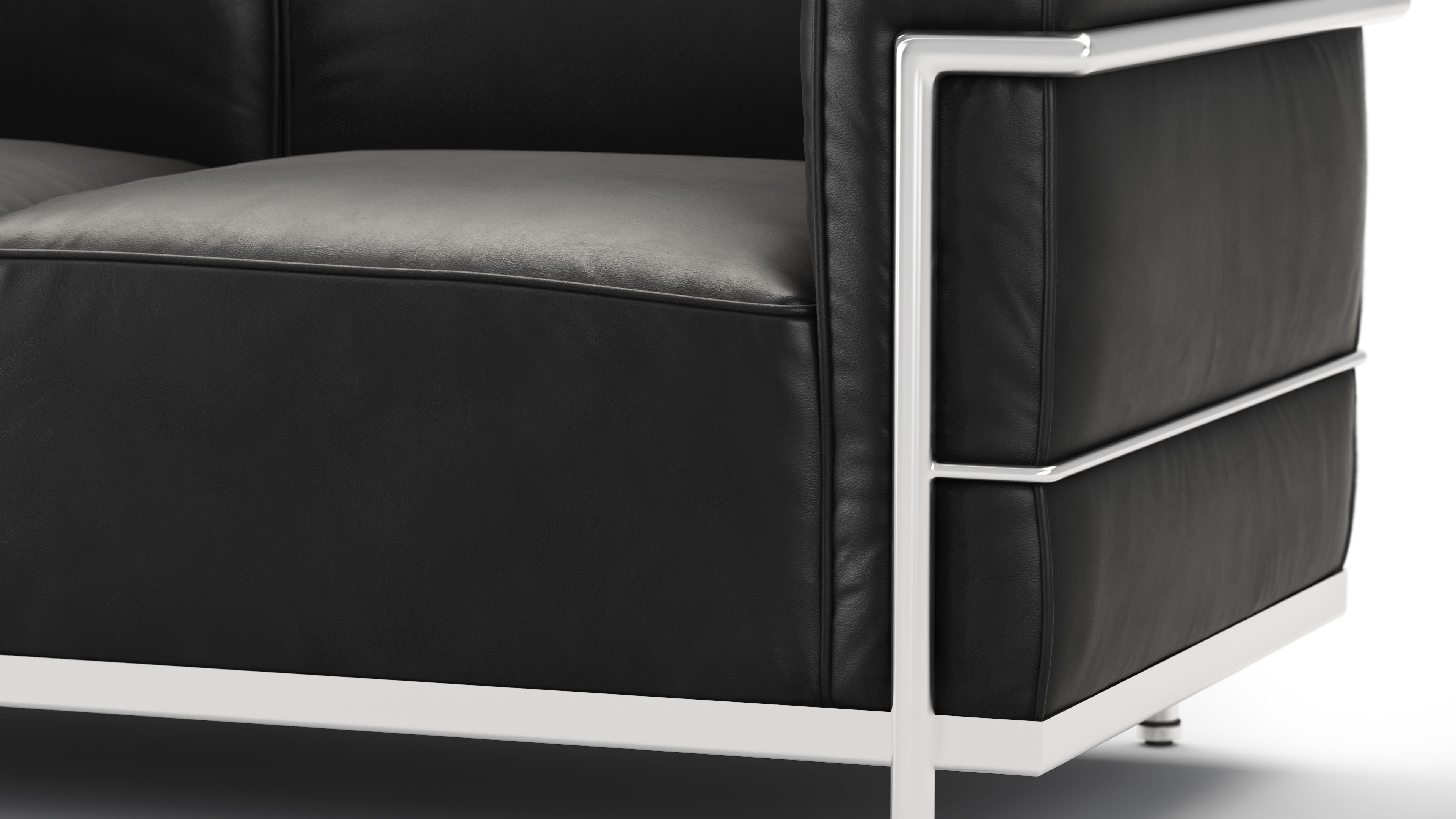 Midnight black LE Corbusier style sofa with removable cushions for easy customization and cleaning.