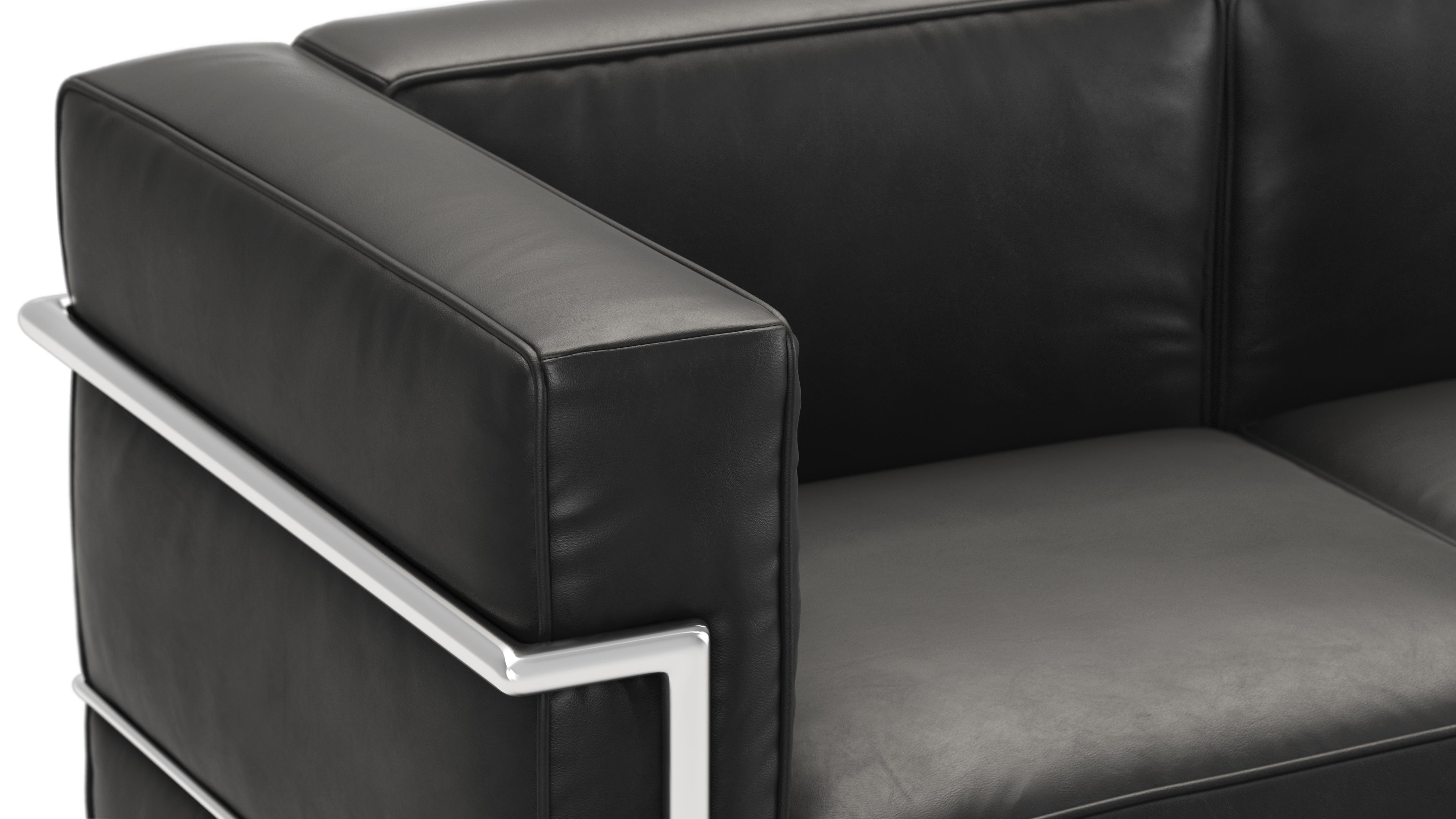 Elegant midnight black Le Corbusier sofa enhancing contemporary living room decor.