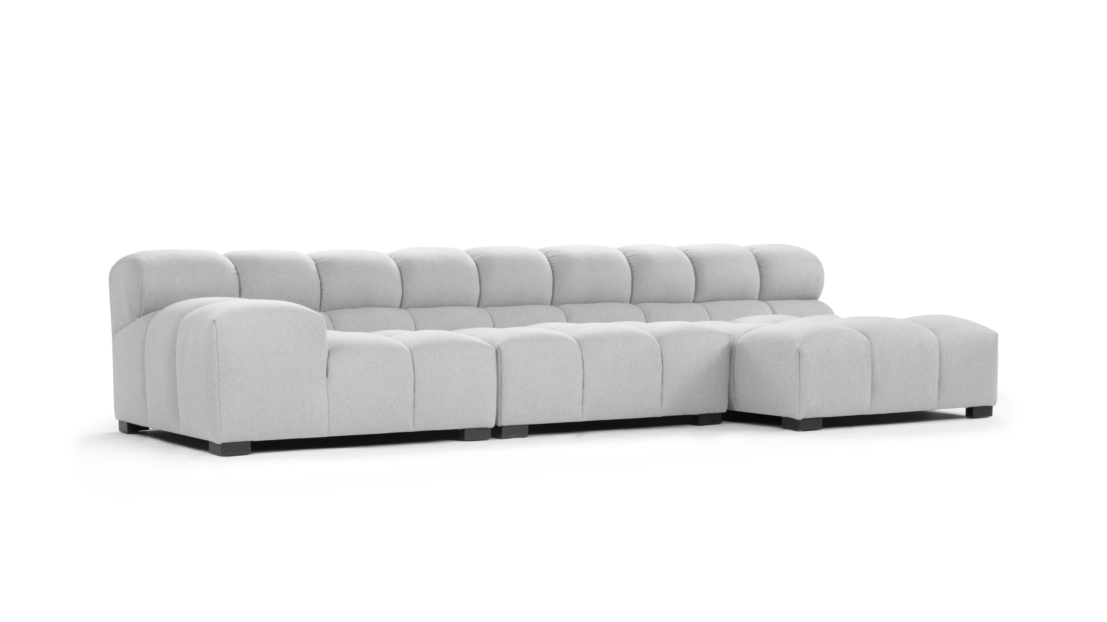 Versatile light gray sectional sofa with a modular design, easily adaptable to various living room configurations.