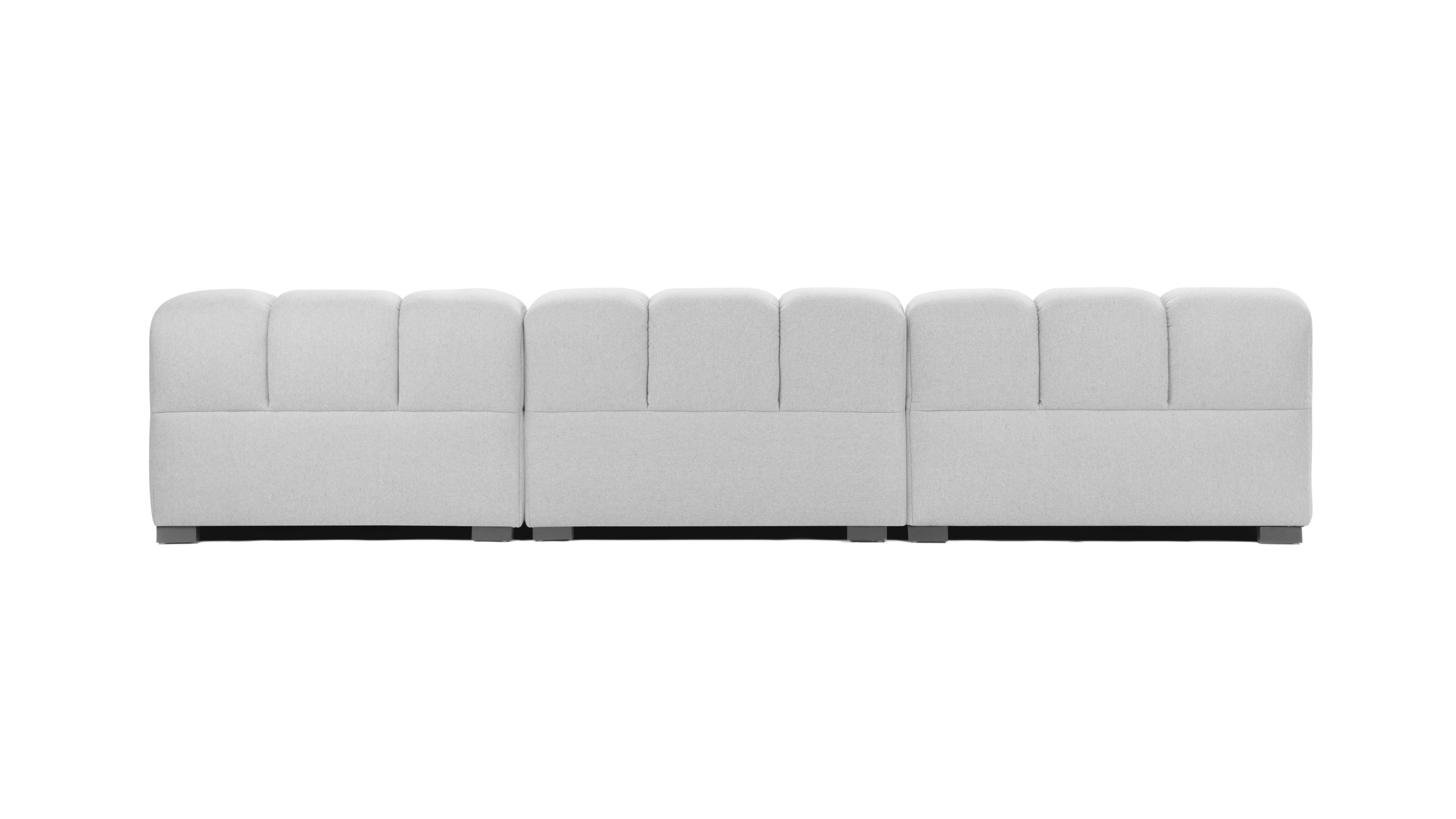 High-quality light gray tufted sofa with polished stainless steel base, blending durability with modern elegance.