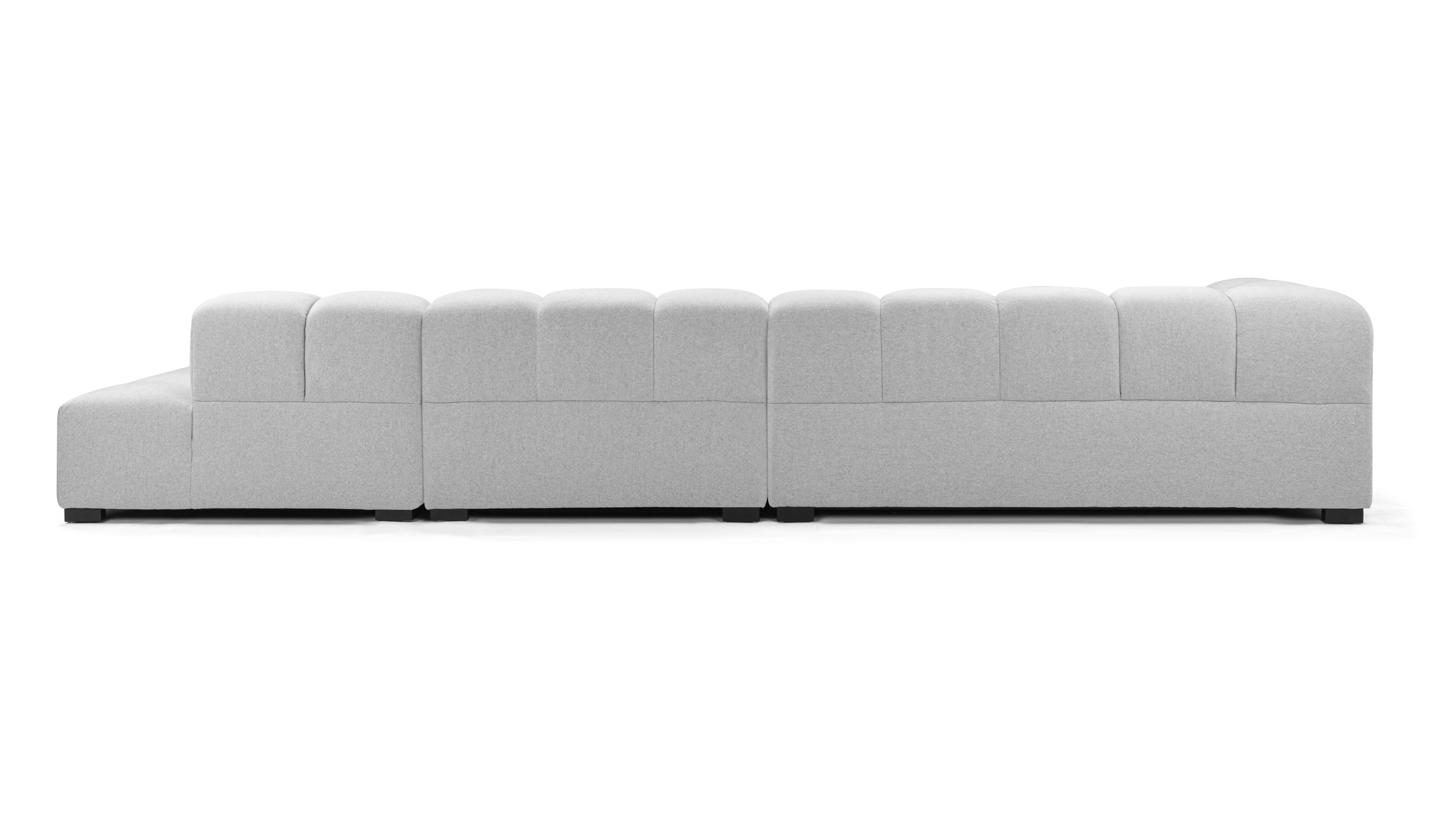 Spacious light gray wool tufted sectional sofa featuring a durable solid Merbau wood frame and sleek stainless steel base.