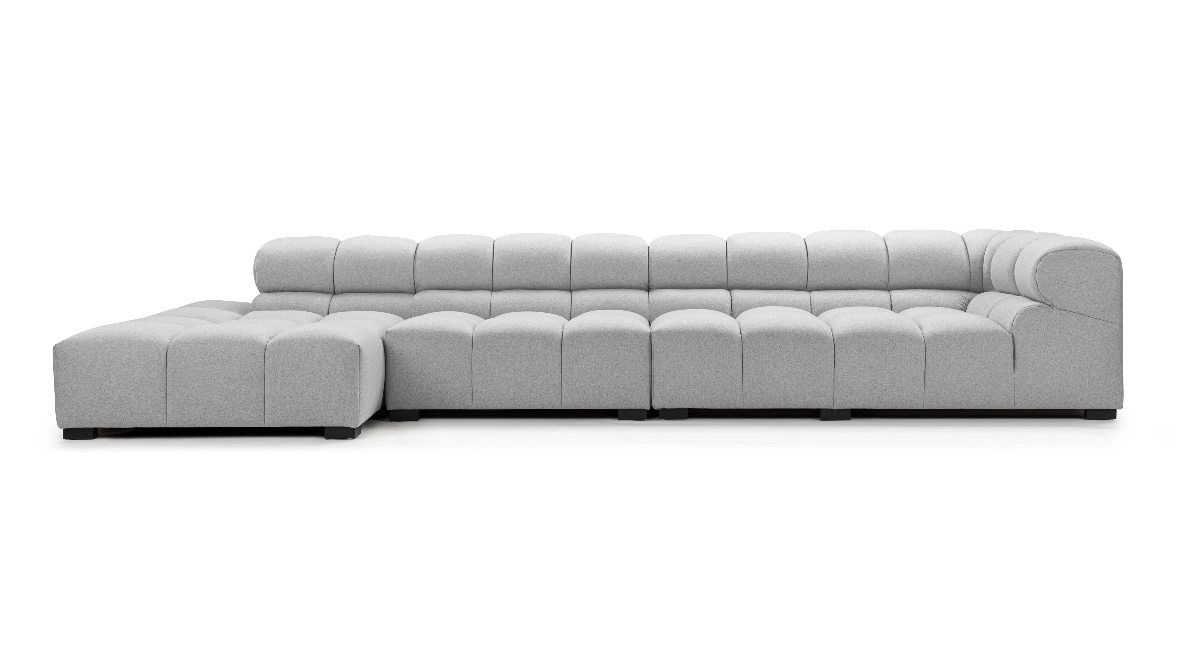 Contemporary styled light gray sectional couch featuring deep cushioned seats and a durable wood frame.