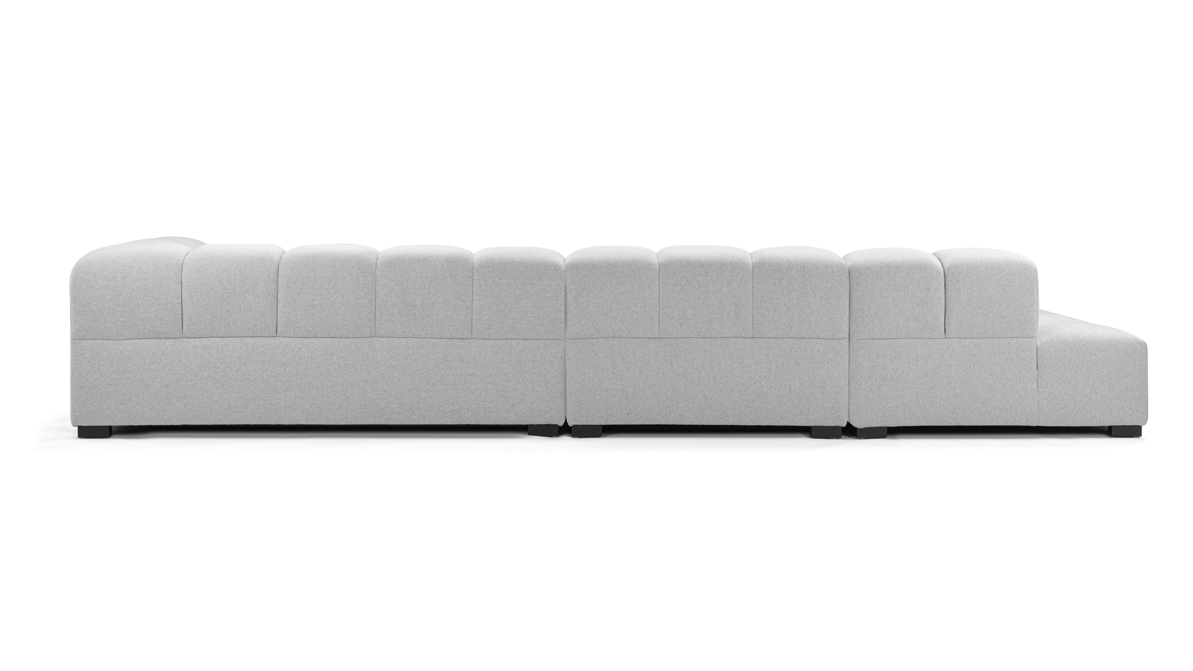 Elegant light gray tufted sofa with sectional design, crafted for longevity and timeless appeal in any setting.