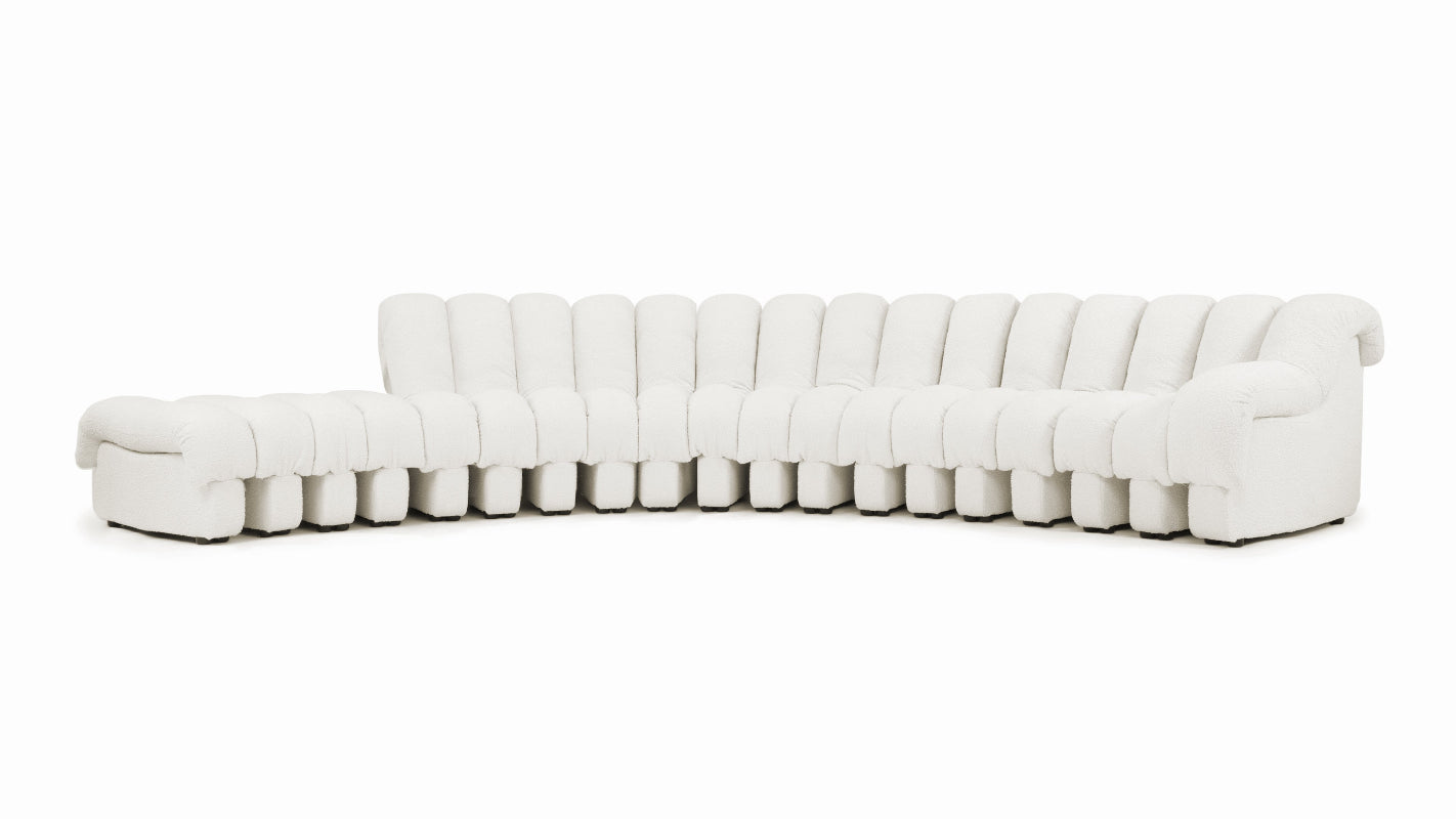 Versatile DS 600 modular sofa configured in a serpentine curve for contemporary home decor.