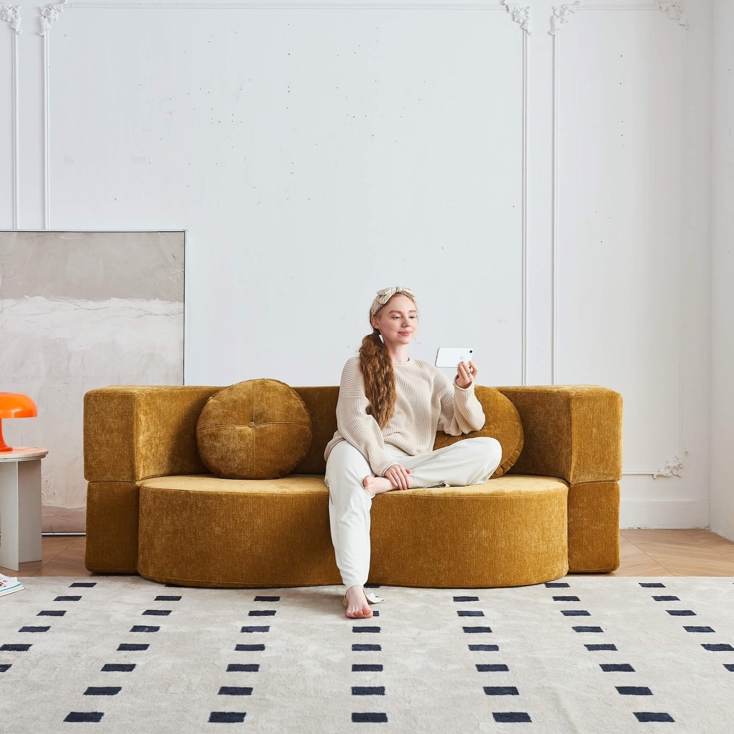 curved-velvet-sofa-bed-expanded-to-guest-bed
