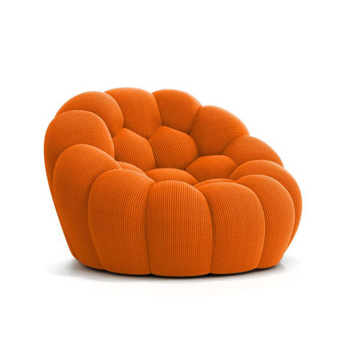 Sacha Lakic's sofa in vibrant living room setting, showcasing modern furniture craftsmanship.