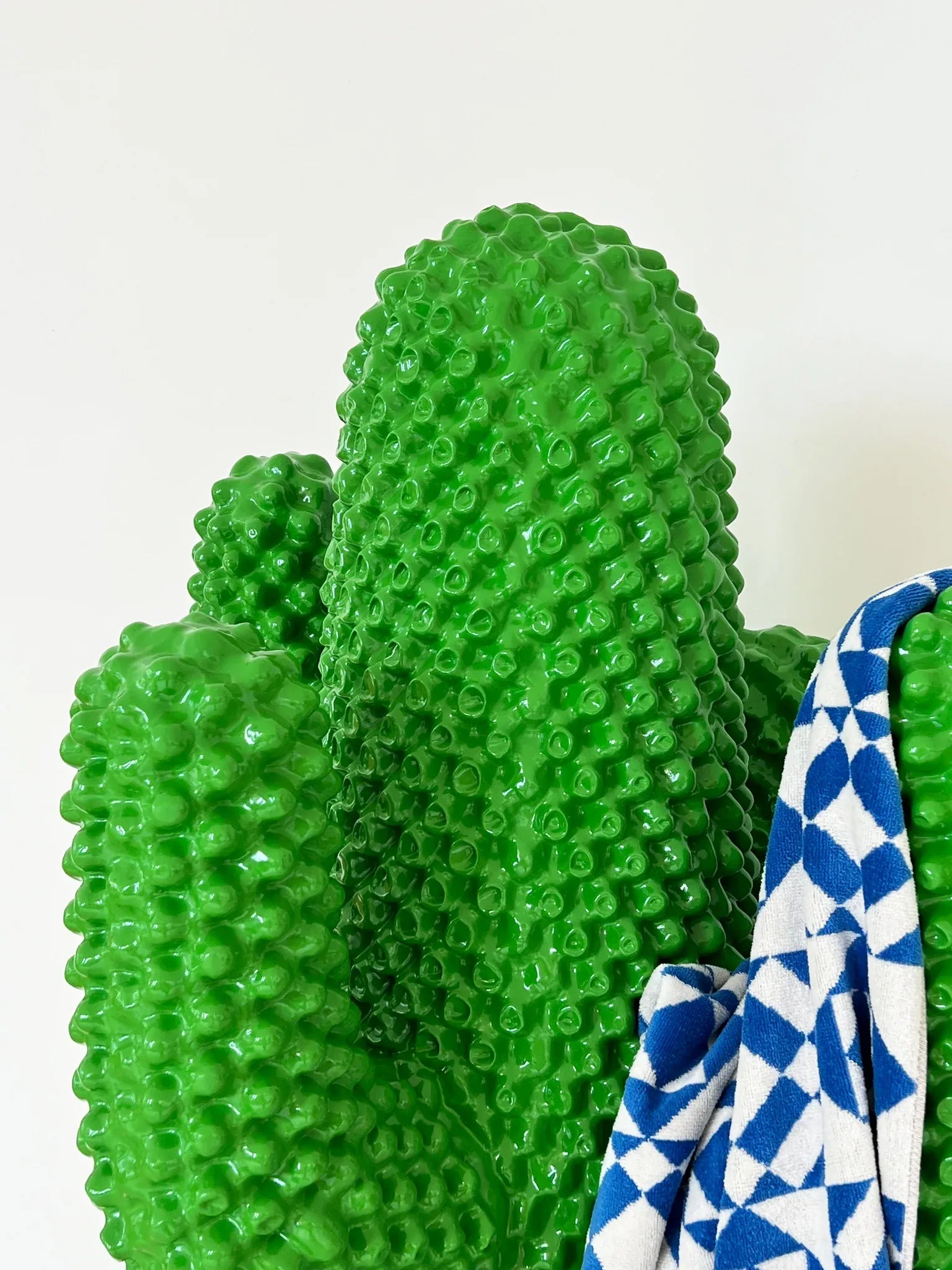 Unique green cactus coat rack, a statement piece for any modern living space.