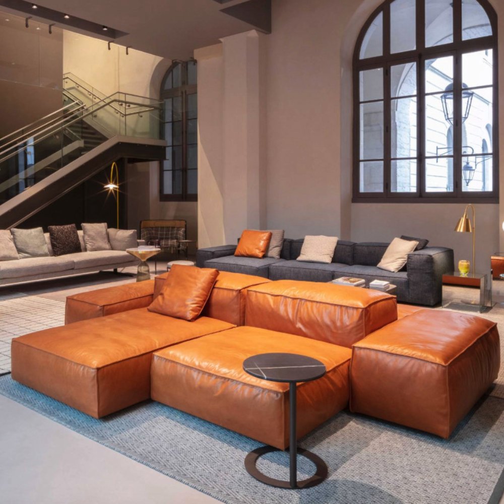 Sophisticated wide modular sofa, combining sculptural presence with practical versatility.