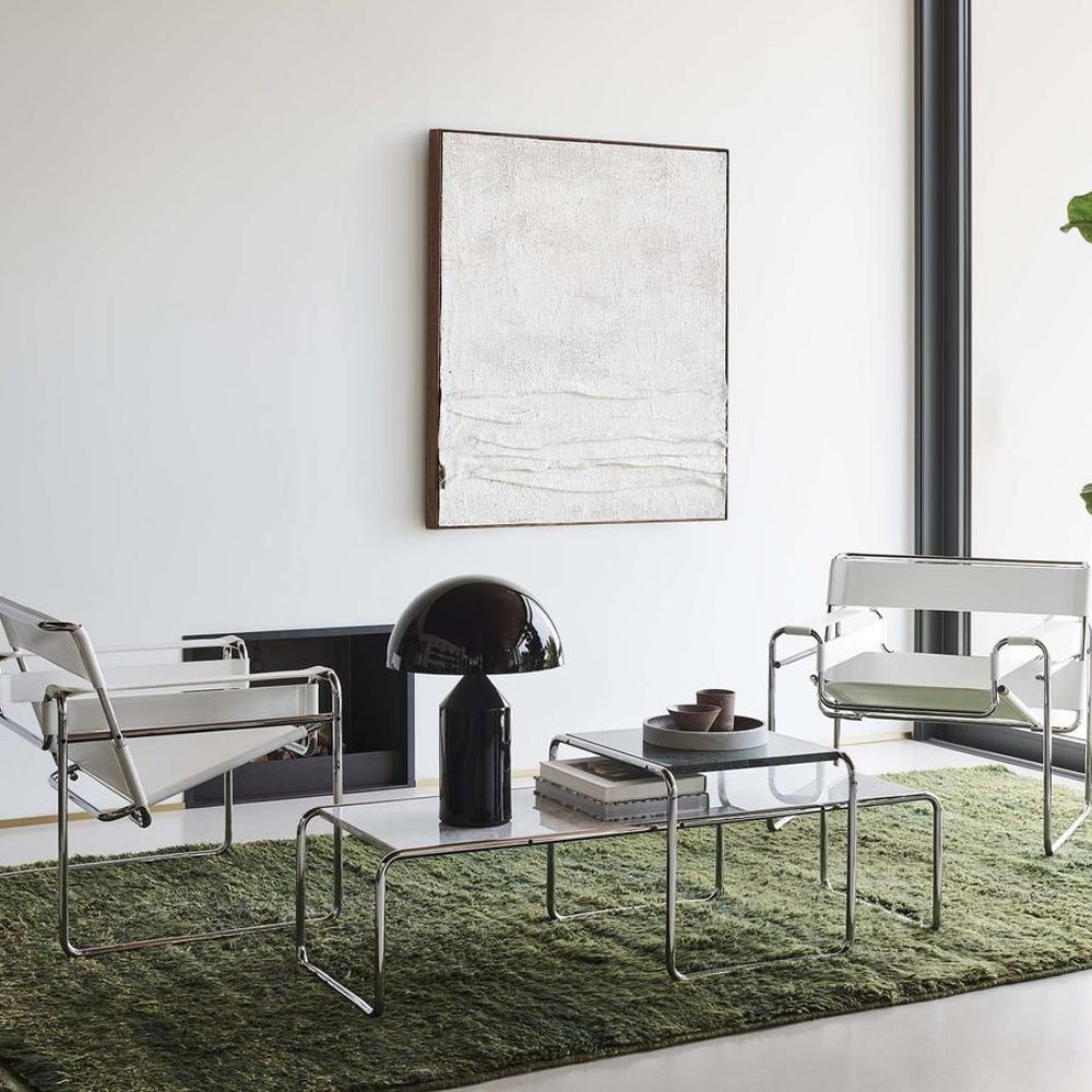 Chic Marcel Breuer Laccio coffee table, combining historical design with contemporary appeal.