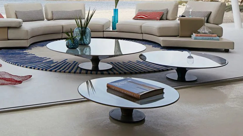 Sophisticated Ovni Up glass cocktail table, designed for modern interiors.