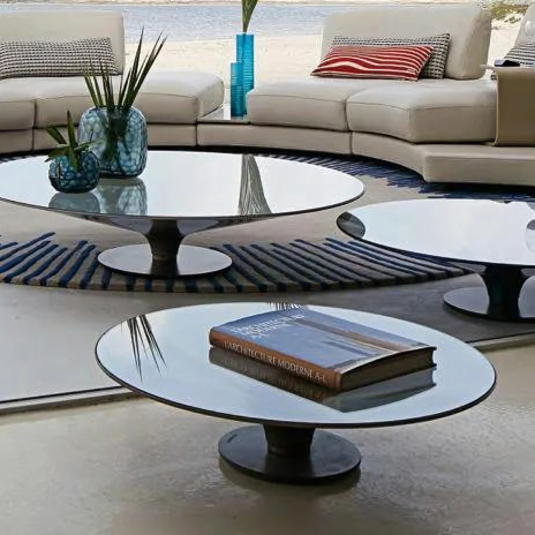 Enhance your home decor with the chic Ovni Uovo cocktail table, featuring a sleek aluminum base and tempered glass top.