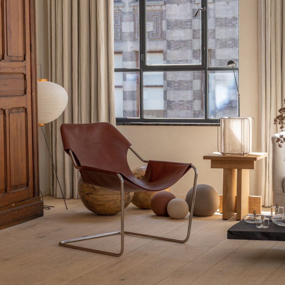 Sophisticated leather reading chair, designed for comfort and style in your favorite nook.