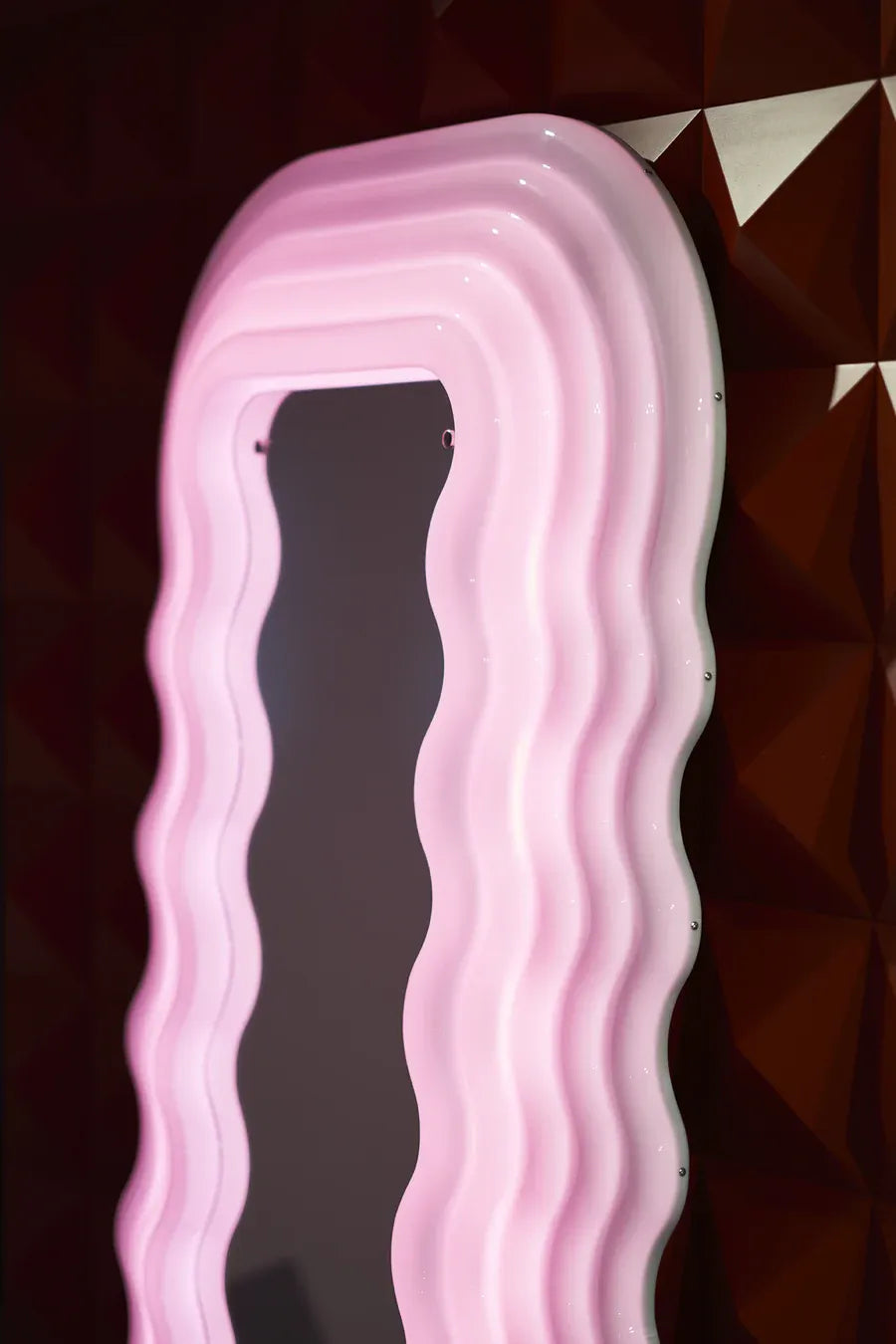 Elegant Ultrafragola Mirror with pink LED light, perfect for unique home decor.