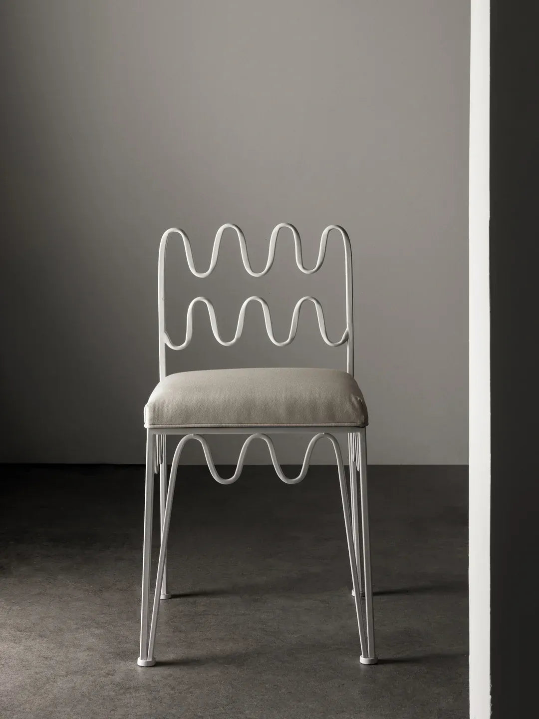 Elegant Wave Chair Ivory, blending art and function inspired by Jean Royère.