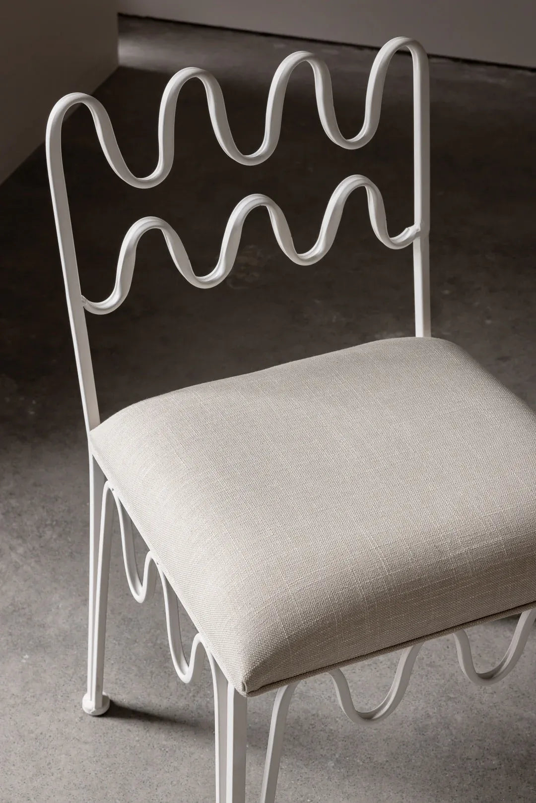 Artistic ivory chair, ideal for adding a touch of French modernist style to any room.