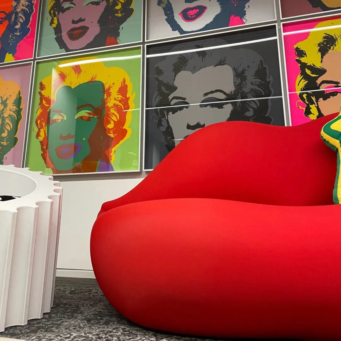 Eye-catching red lips couch, blending bold design with luxurious seating comfort.